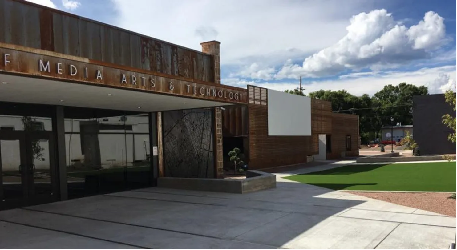 Photograph of the front of the Department of Media Arts & Technology at New Mexico Highlands University building.